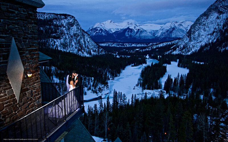 Couple on balcony at dusk