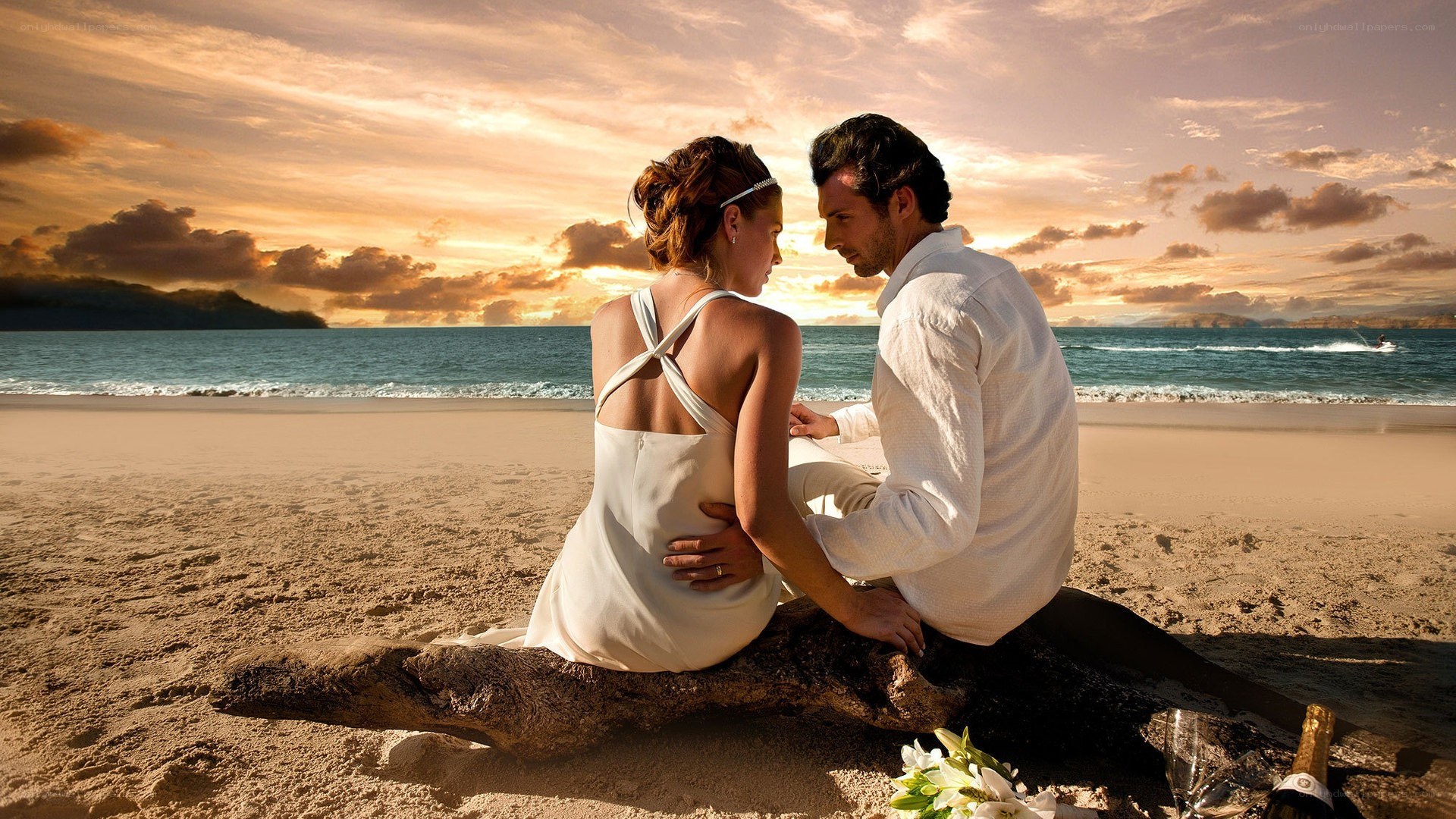 Couple on beach at sunset