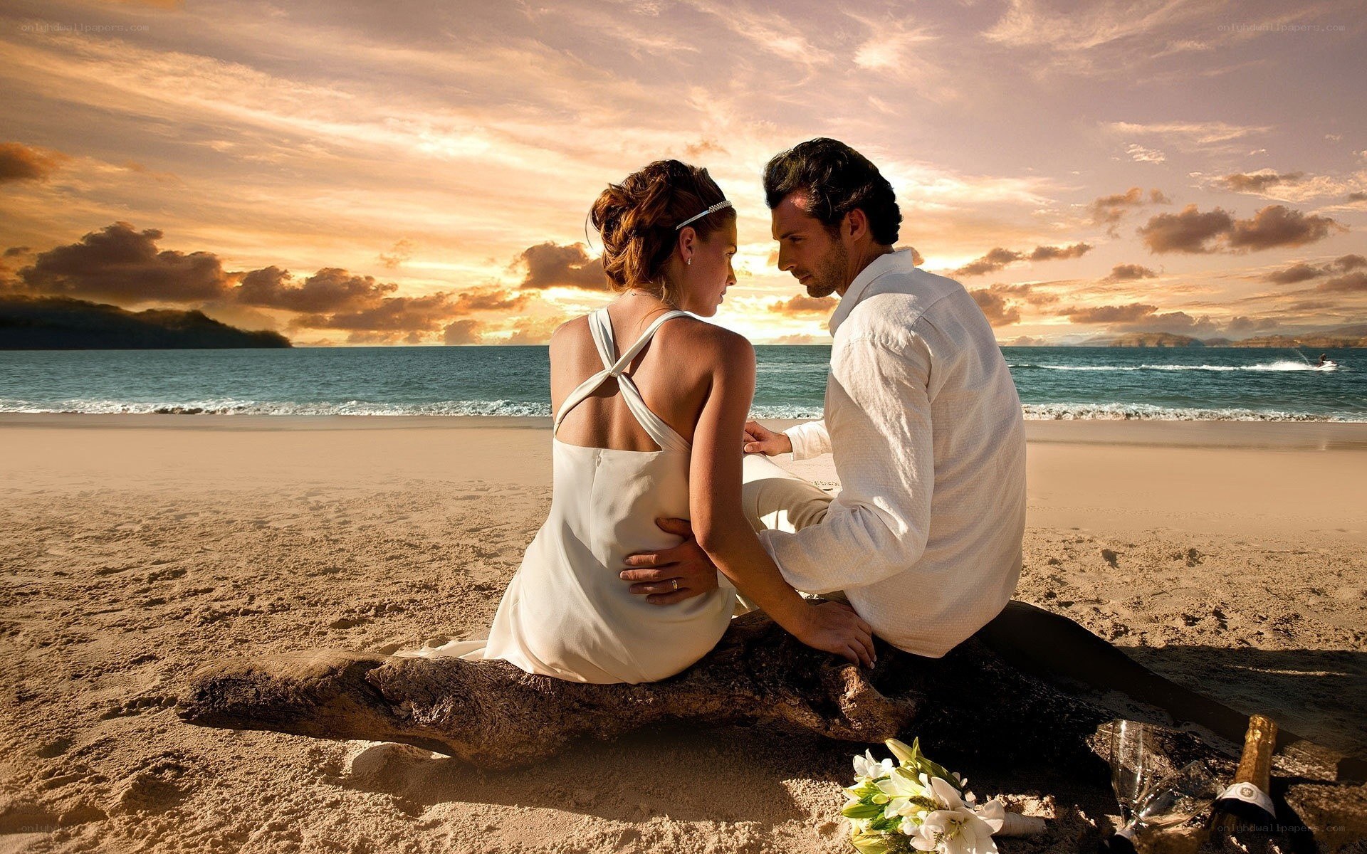 Couple on beach at sunset