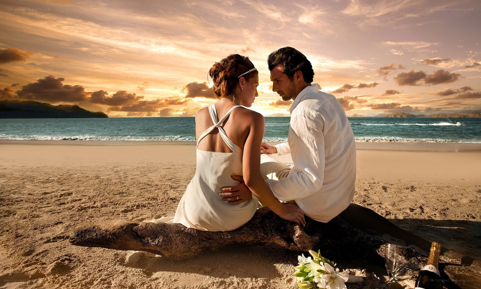 Couple on beach at sunset