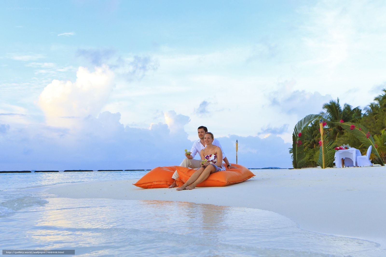 Couple on beach at sunset