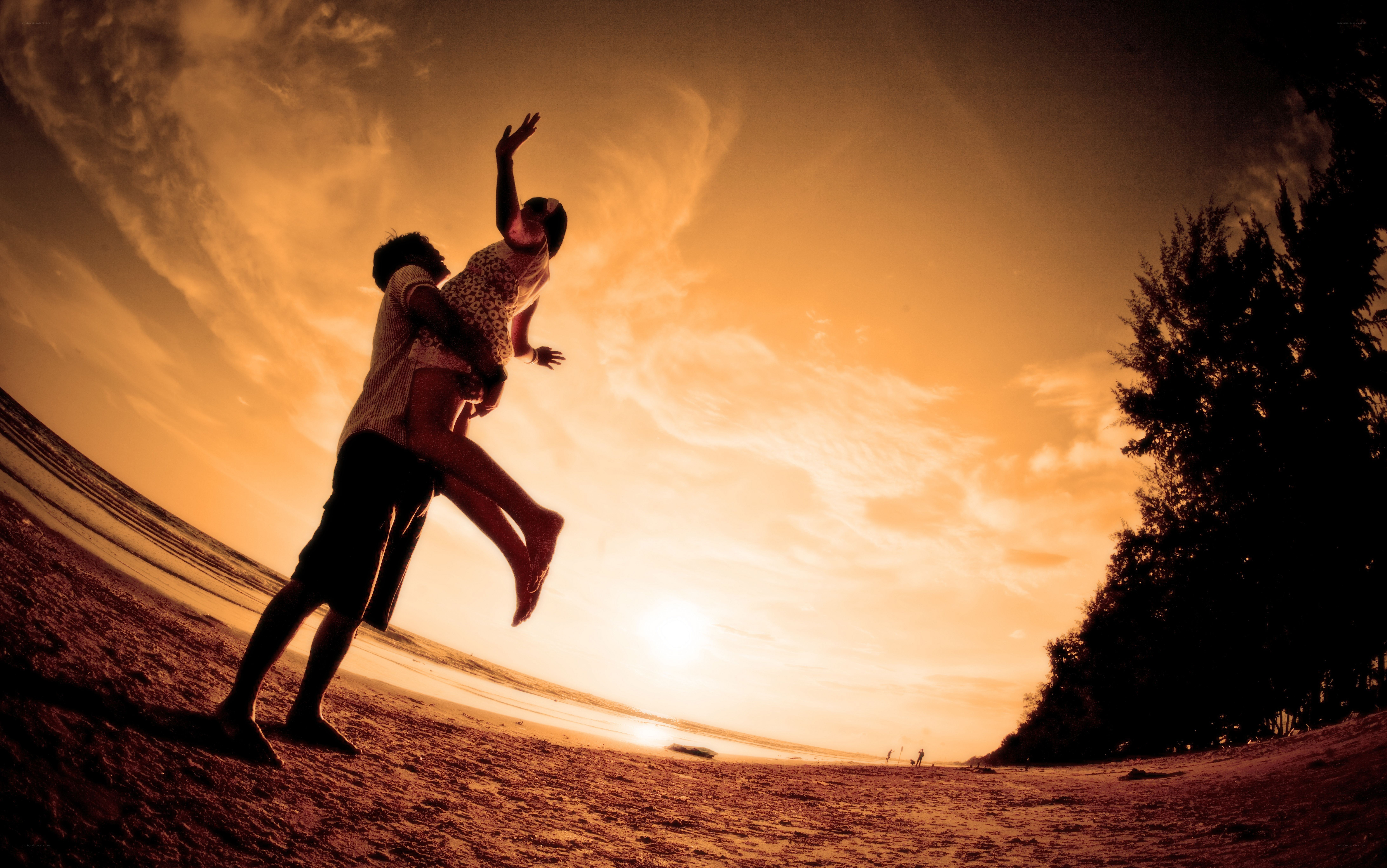 Couple on beach at sunset