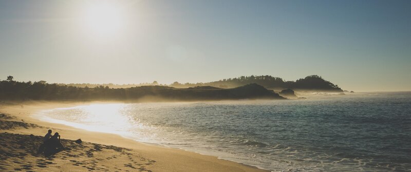Couple on Beach at Sunset — Blue, Serene, Photograph, Ocean, Sun