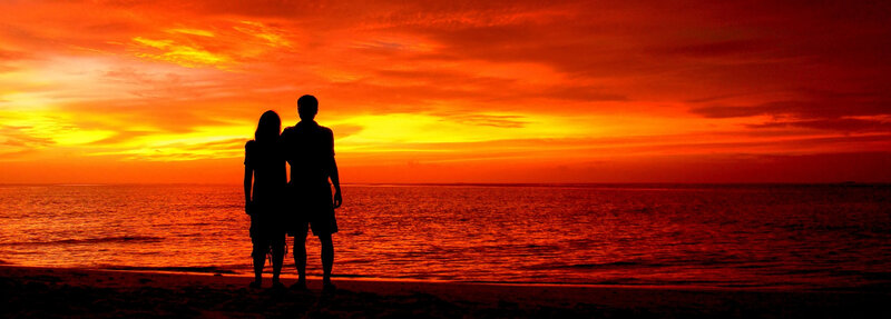 Couple on Beach at Sunset — Orange, Dramatic, Photograph, Silhouette