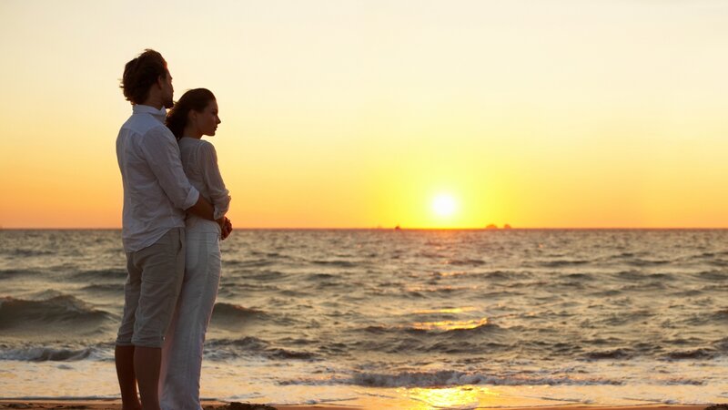 Couple on Beach at Sunset — Orange, Serene, Photograph, Ocean, Sun