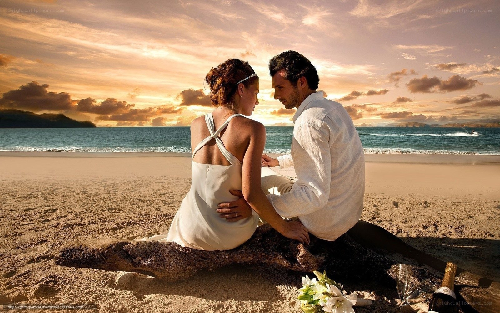 Couple on beach at sunset