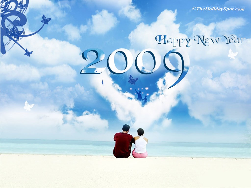 Couple on beach celebrating 2009