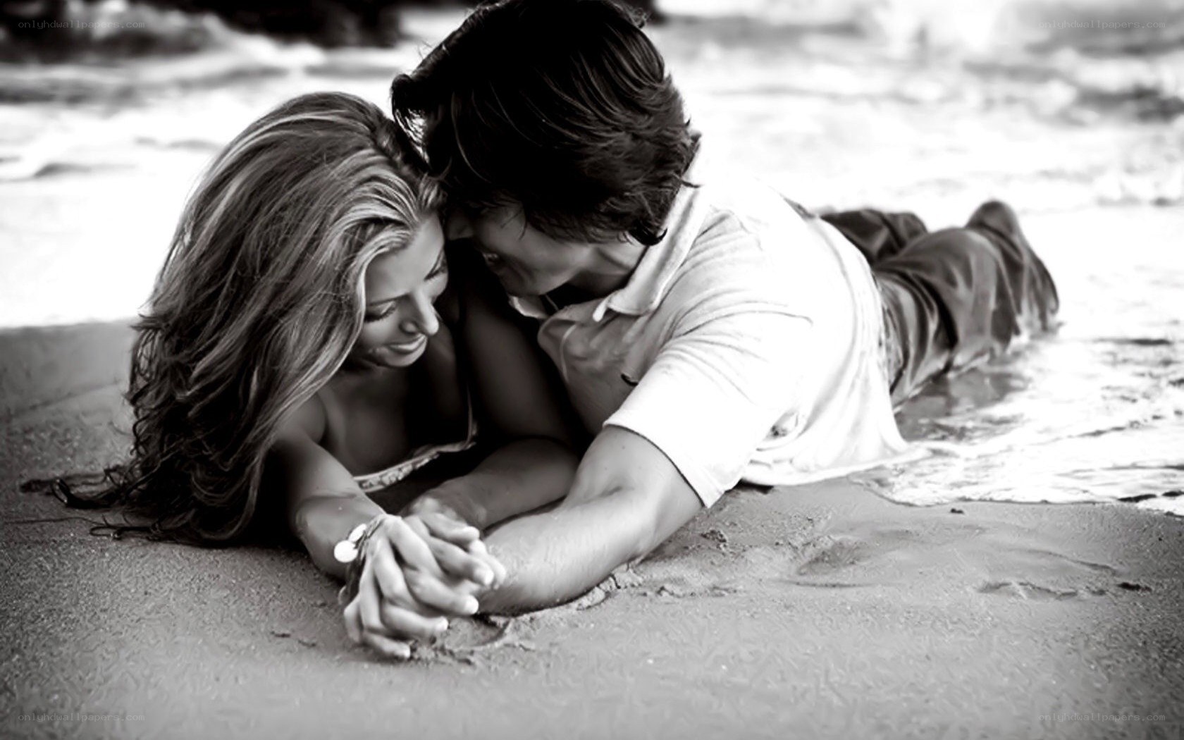 couple on beach holding hands