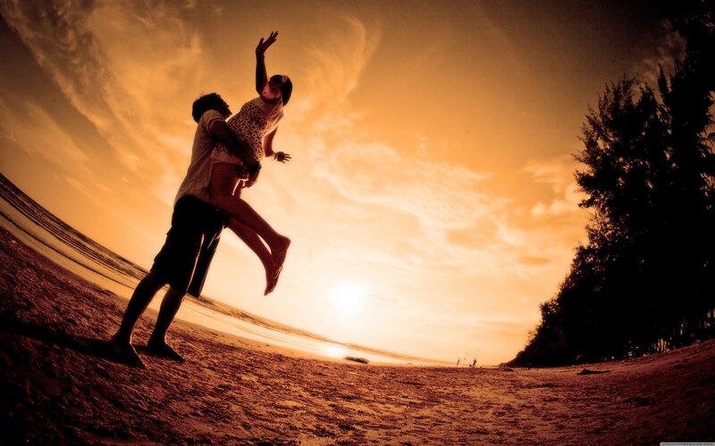 Couple on Beach — Orange, Dramatic, Sunset, Photograph, Sand