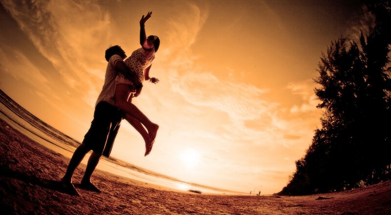 Couple on Beach — Orange, Dramatic, Sunset, Photograph, Sky