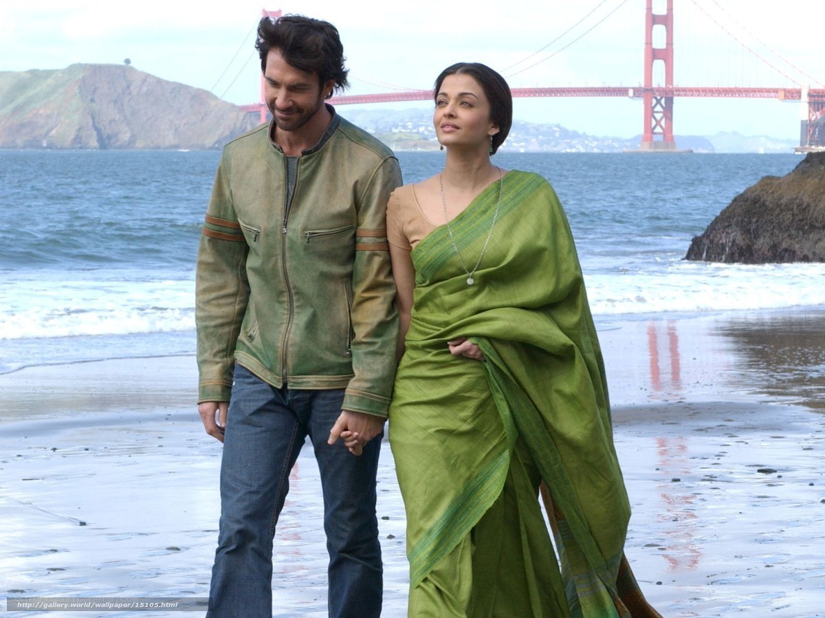 Couple on beach with Golden Gate Bridge