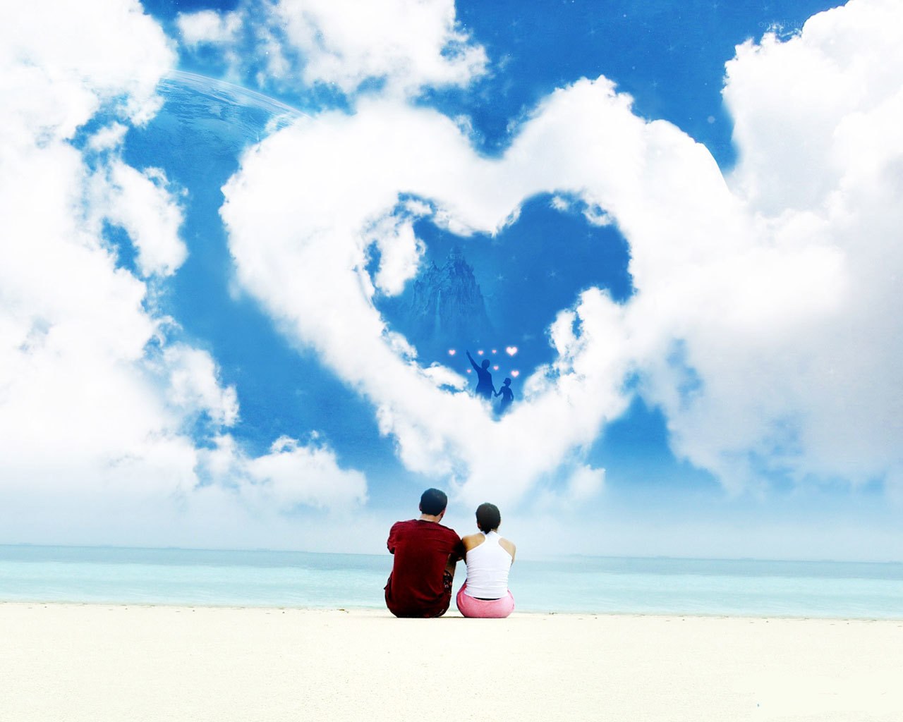 Couple on beach with heart cloud