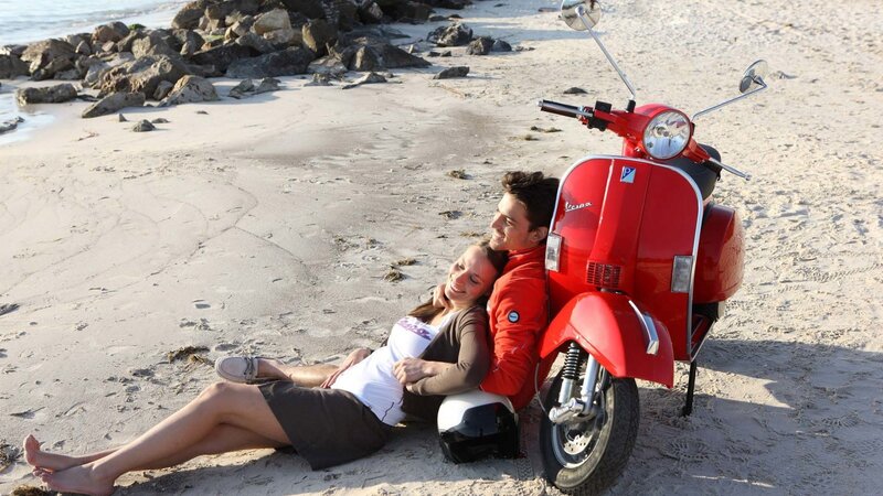Couple on Beach with Scooter — Red