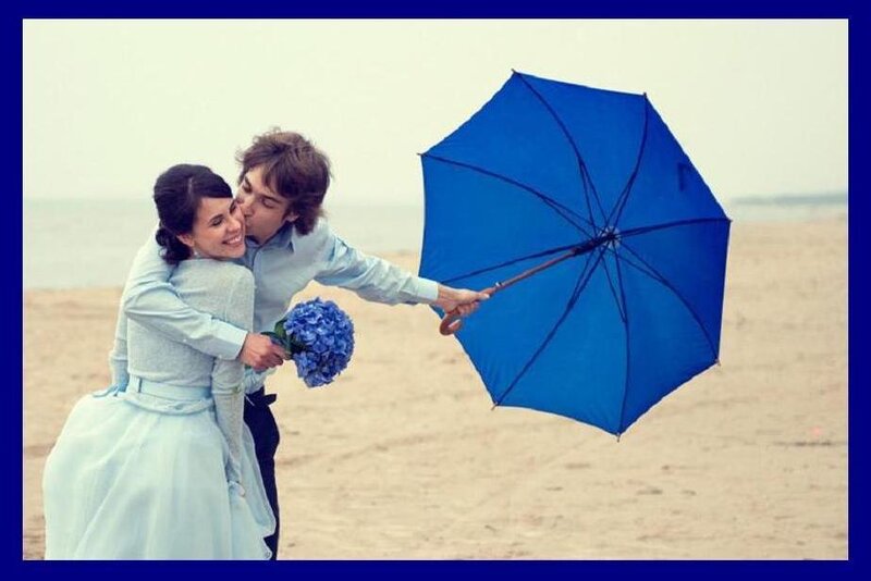 Couple on Beach with Umbrella