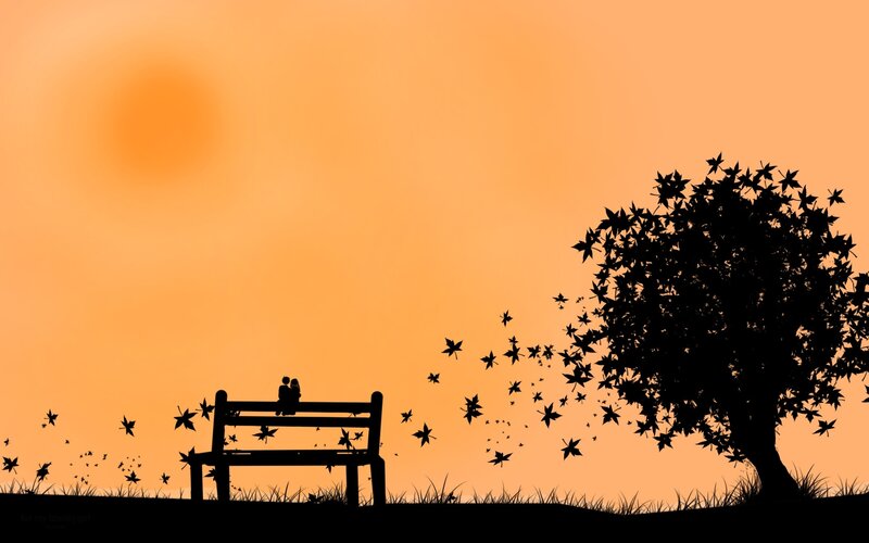 Couple on bench at sunset