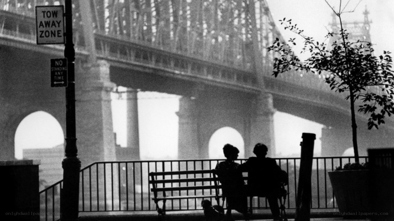 Couple on bench by bridge