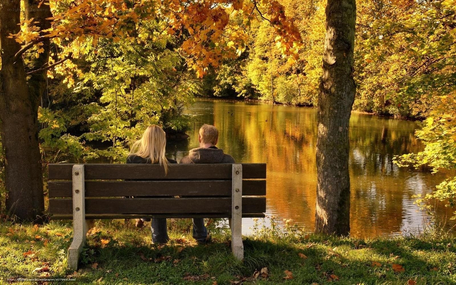 Couple on bench by lake