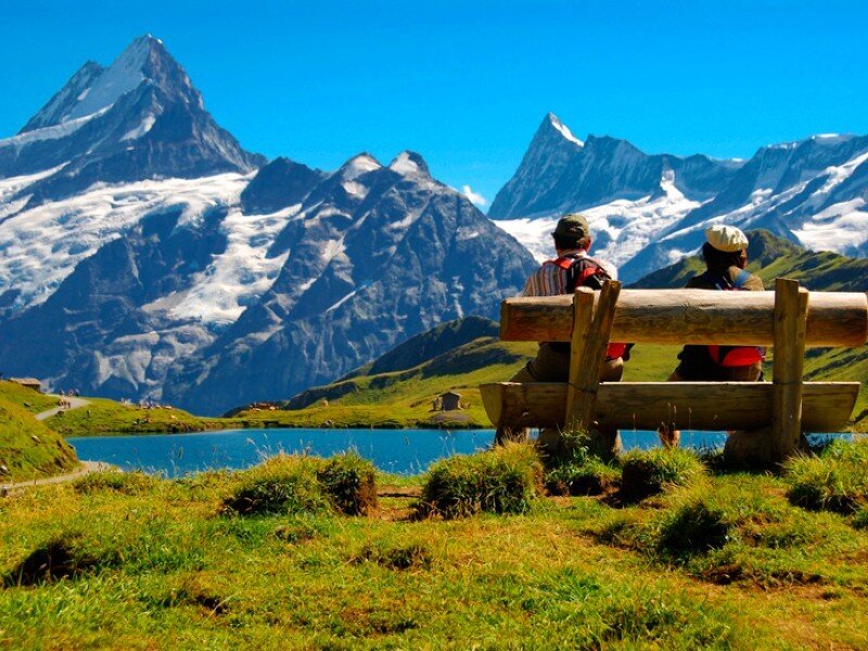 Couple on bench with mountain view