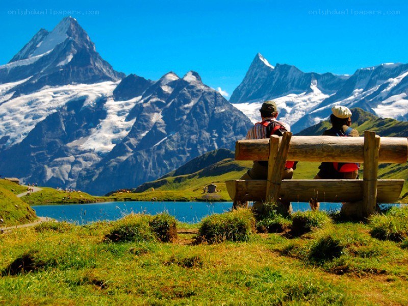 Couple on bench with mountain view