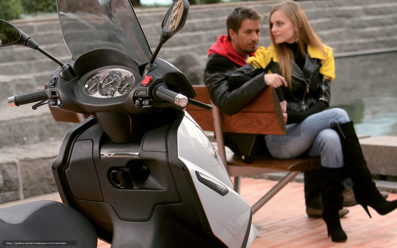 Couple on bench with scooter