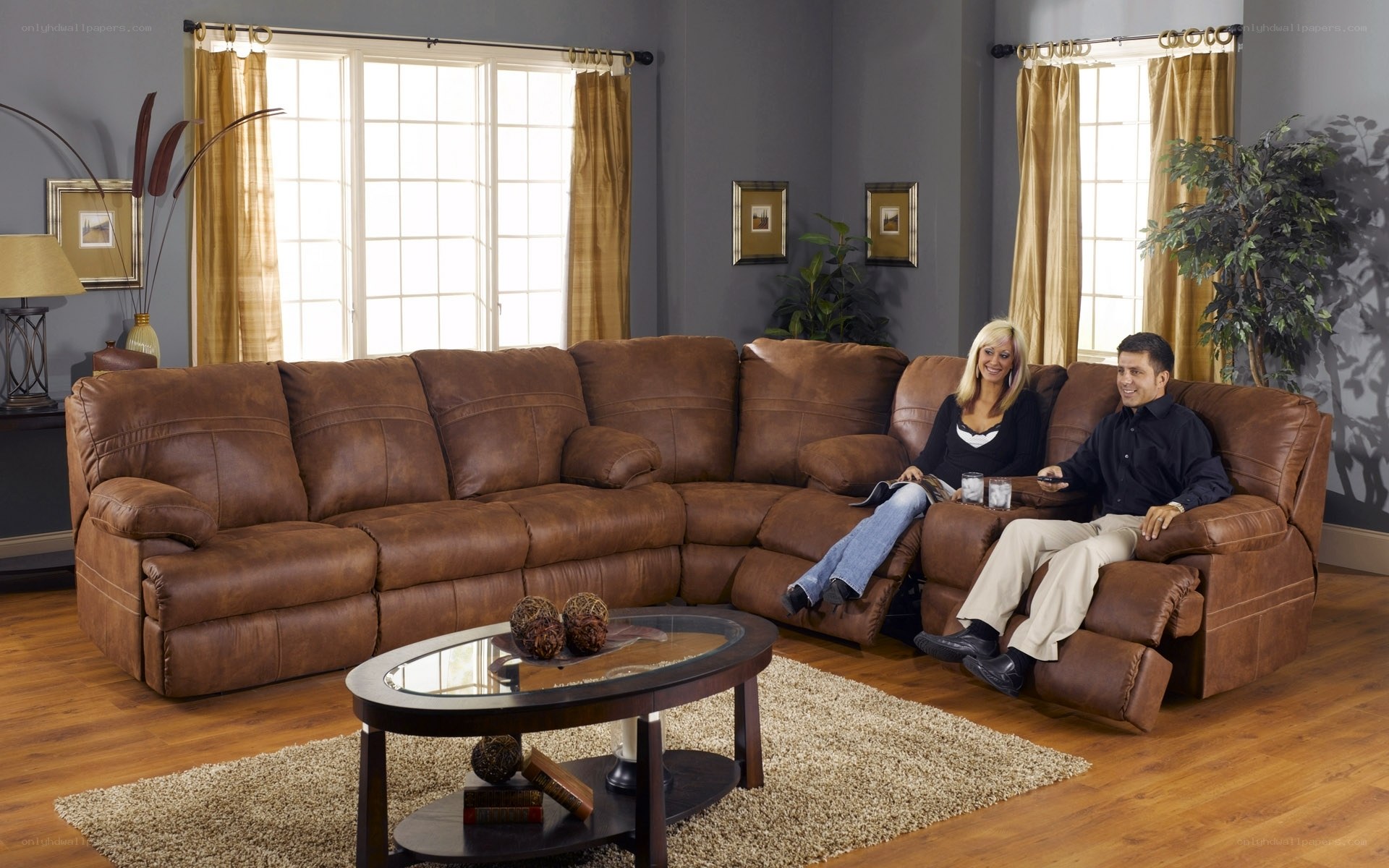 Couple on brown leather sectional