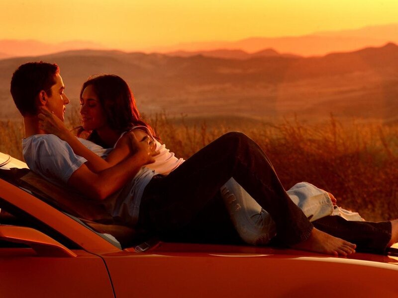 Couple on Car Hood — Orange, Romantic