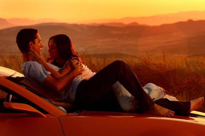 Couple on Car Hood — Orange