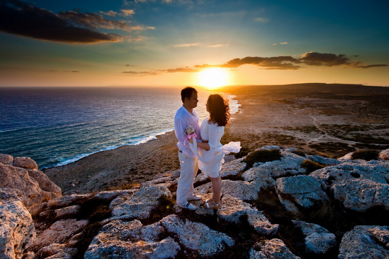 Couple on Cliff at Sunset — Blue