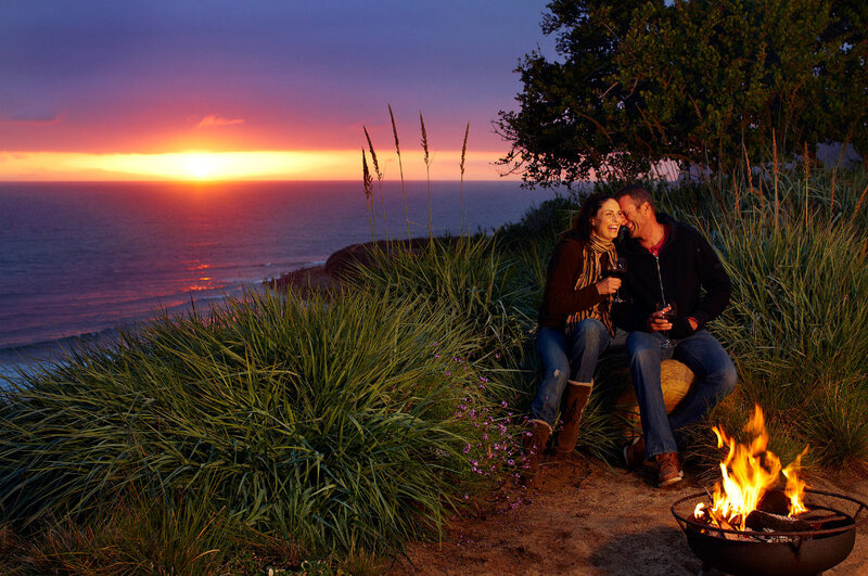Couple on Cliff at Sunset