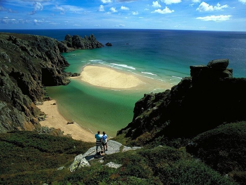Couple on Cliff Overlooking Beach