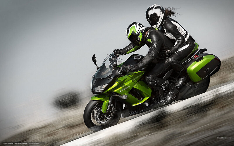 Couple on green motorcycle