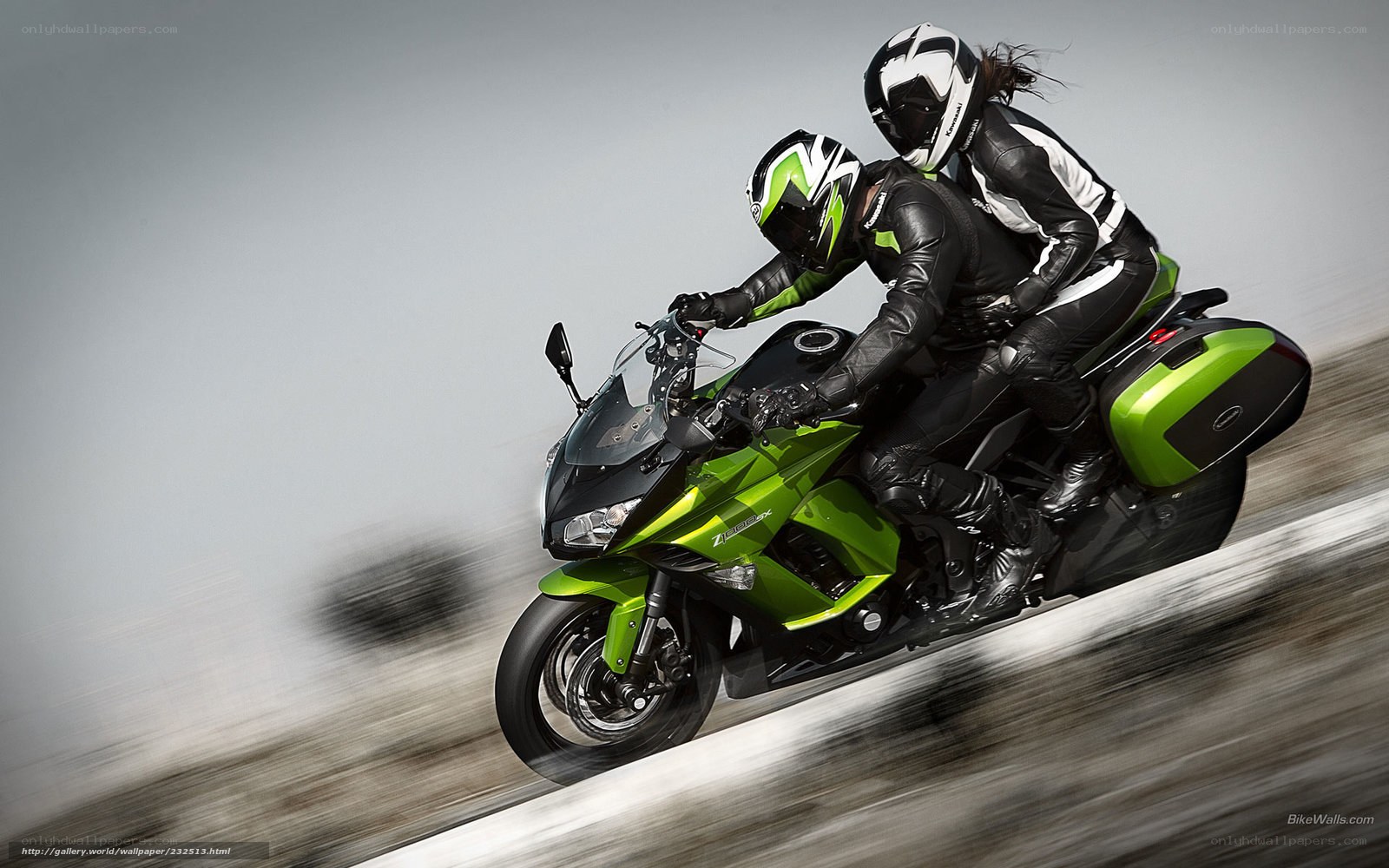 Couple on green motorcycle
