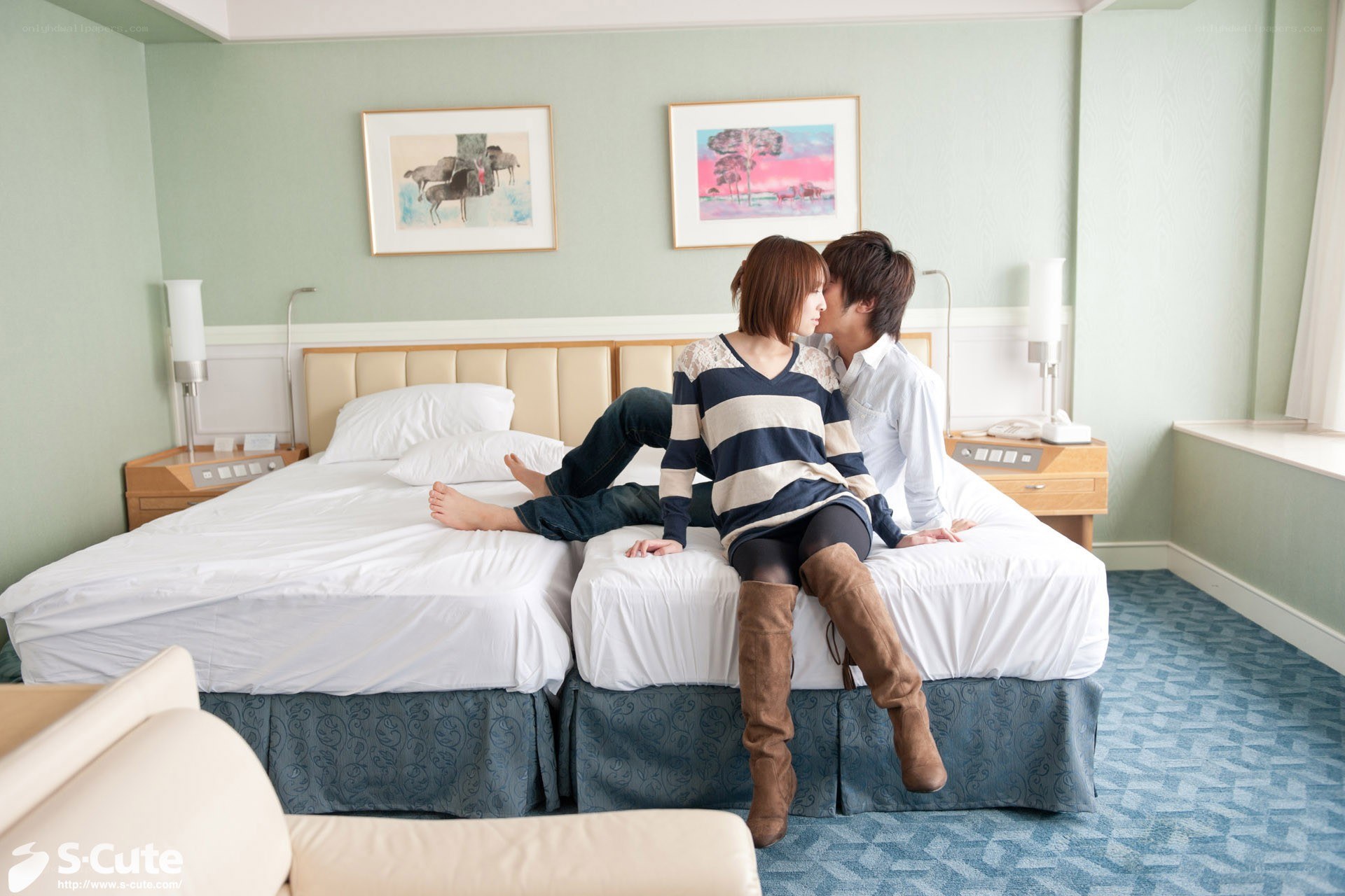 Couple on hotel beds