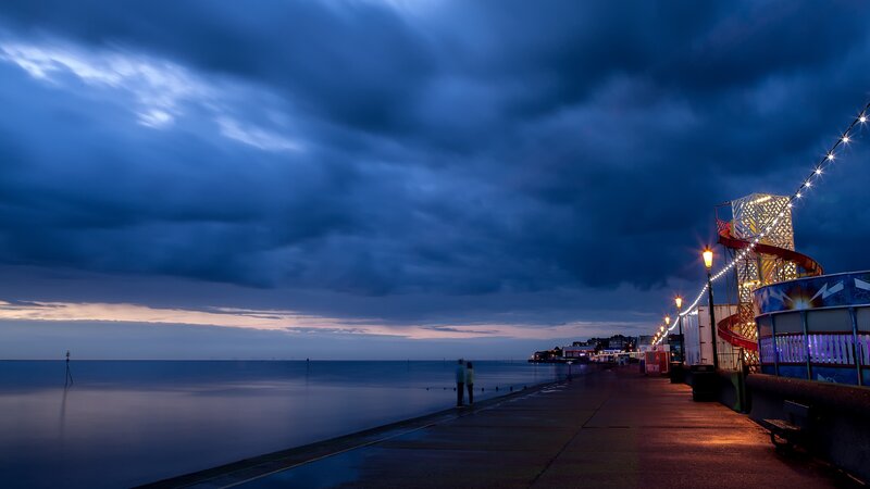 Couple on Pier at Dusk — Blue, Dramatic