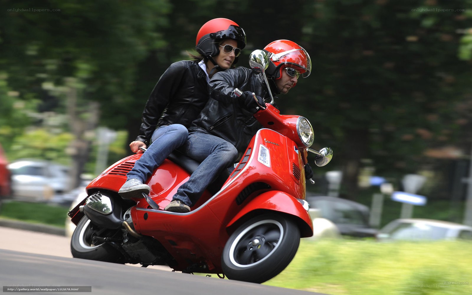 Couple on red scooter