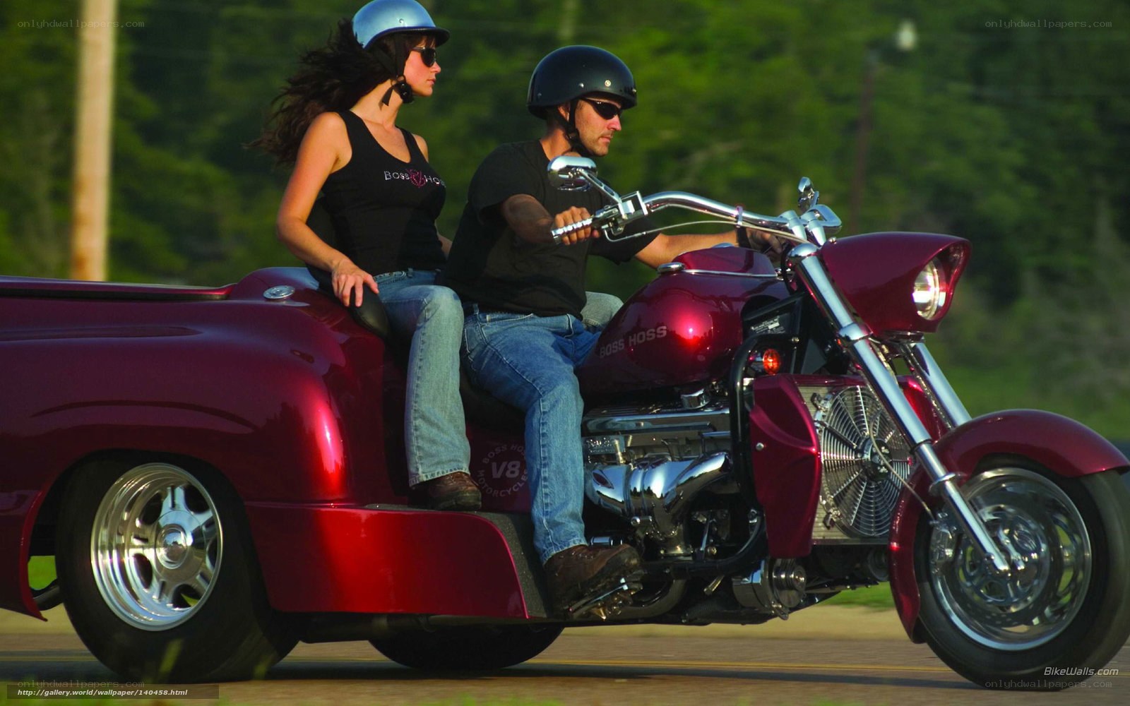 Couple on red trike motorcycle