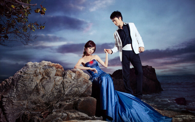 Couple on Rocky Shore — Blue, Dramatic, Sunset