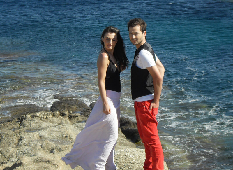 Couple on rocky shore