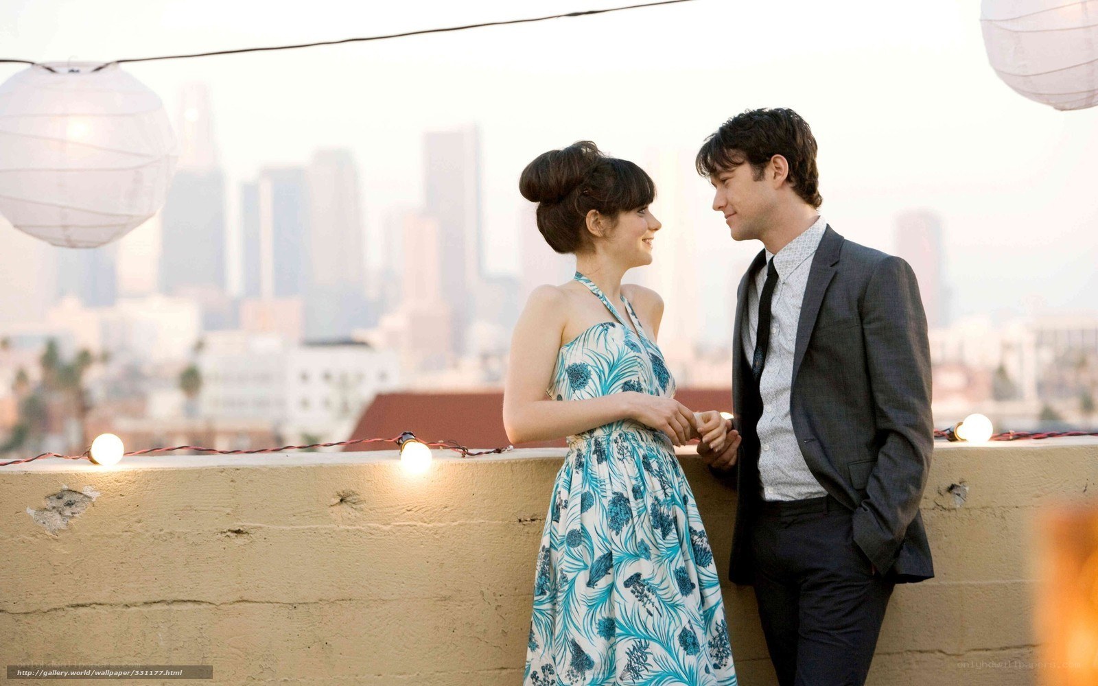 couple on rooftop with city view