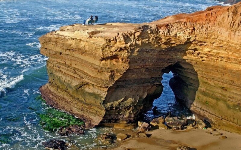 Couple on Sea Arch