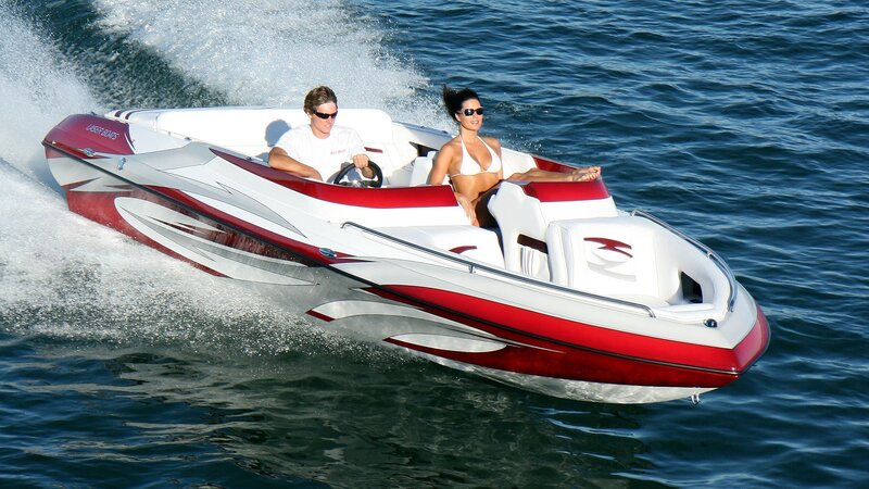 Couple on speedboat at sea