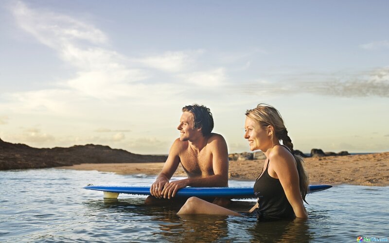 Couple on Surfboard