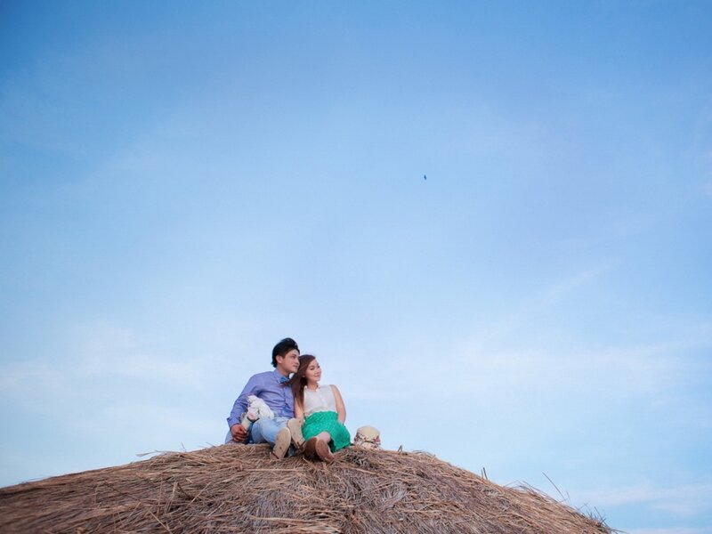 Couple on Thatched Roof