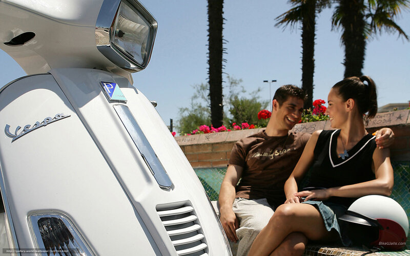 Couple on Vespa scooter