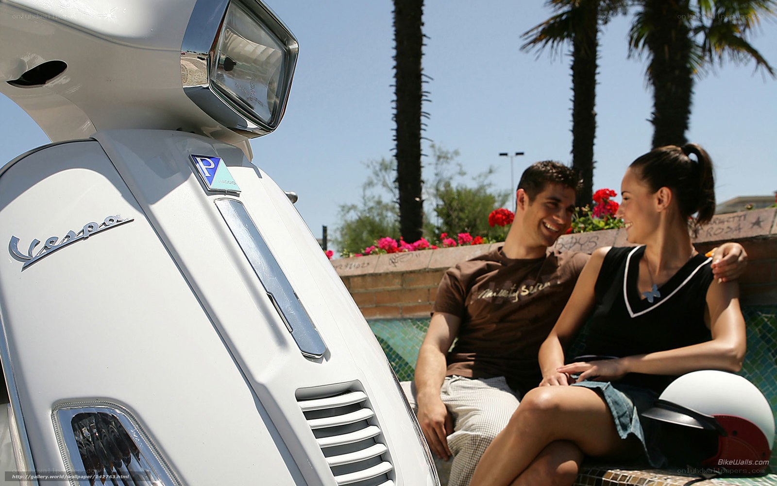 Couple on Vespa scooter