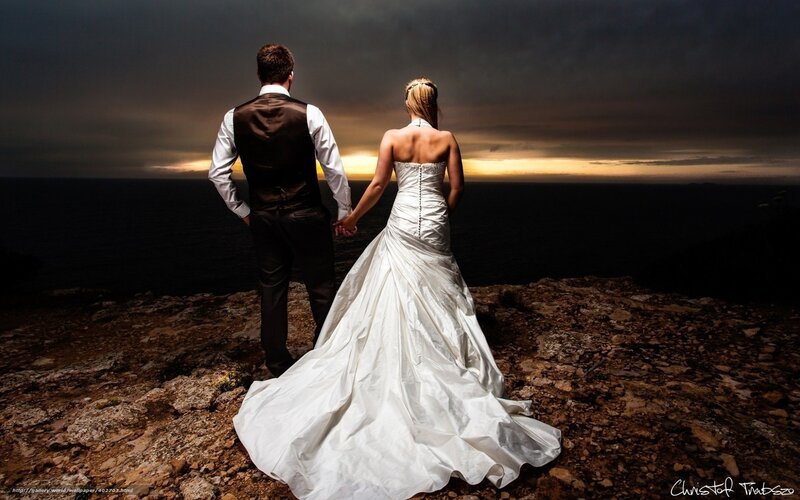 Couple on wedding day at sunset