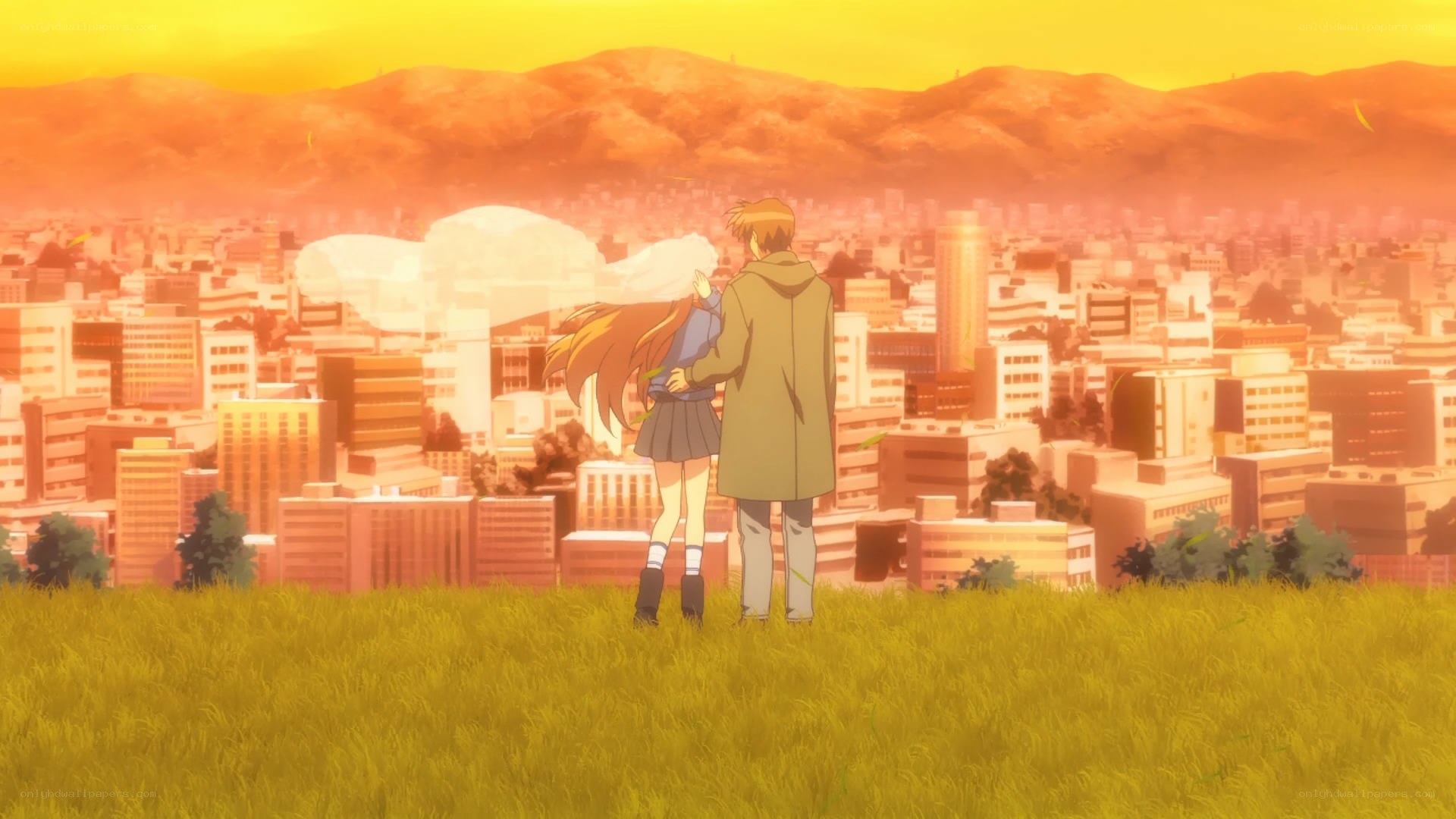 couple overlooking city at sunset