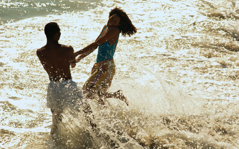 Couple Playing in Ocean — Blue, Playful