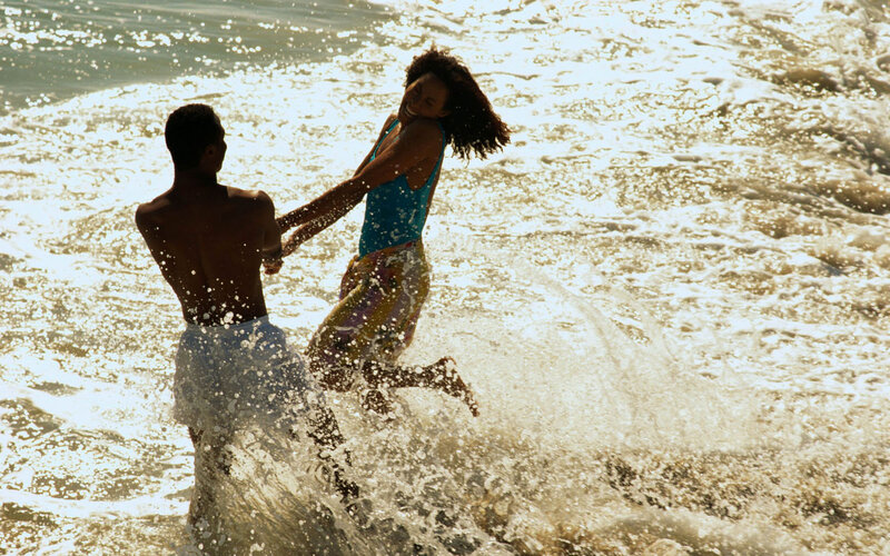 Couple Playing in Ocean — Blue