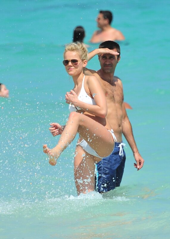 Couple playing in ocean waves